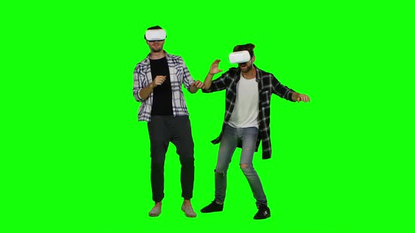 Two Young Man with a Virtual Reality Headset. Green Screen