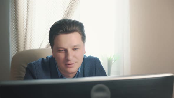 Man Making Video Call Using Computer