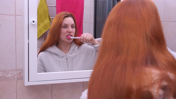 Happy Beautiful Woman Brushing Her Teeth