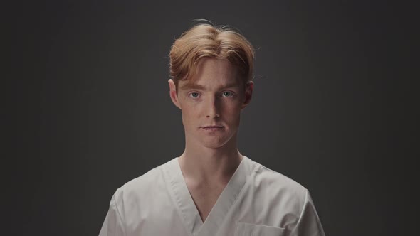 Portrait Of Young Guy In Medical Gown