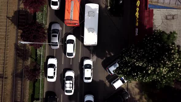 Top Down Street View of Freeway Busy City Rush Hour Heavy Traffic Jam Highway and Tram Way.