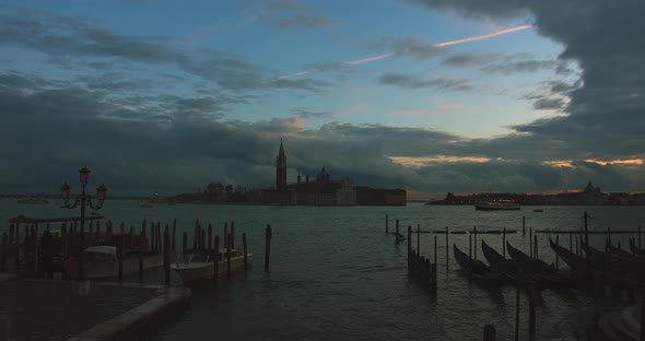 Timelapse of the Port for the Gondola with Sunset and the Movement of Clouds and Ships in the