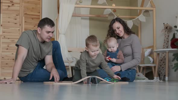 Happy Young Family Full Body Playing at Home