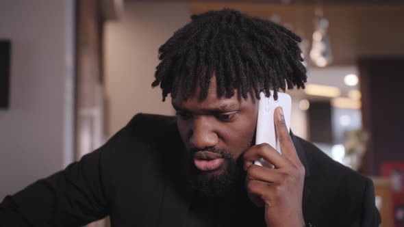 African American Businessman in Suit Talking on the Phone