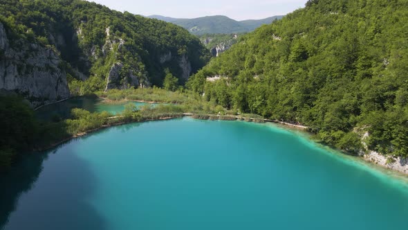 View of the beautiful Plitvice Lakes National Park with many green plants and beautiful lakes and th