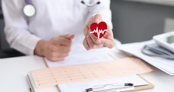 Doctor Cardiologist Holding Heart Shaped Icon with Ecg and Showing Thumb Up  Movie