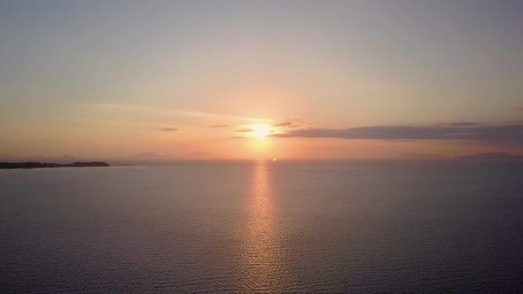 Aerial view of beautiful ocean sunset in Thailand - camera tracking