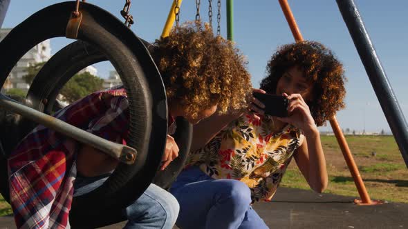 Mother and son having fun at playground