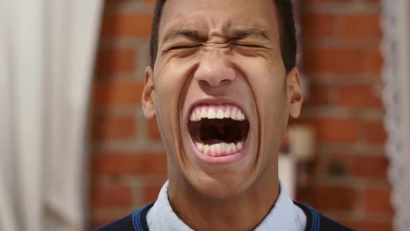 Angry African Man Screaming Loud Shouting in Anger