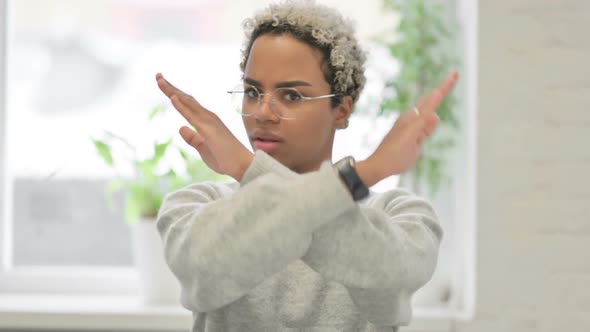 Portrait of African Woman Showing No Sign By Arm Crossed