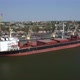Loading Grain Onto a Cargo Ship for Transportation By Sea By a Conveyor Belt Machine - VideoHive Item for Sale