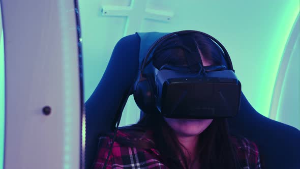 Young Girl Looking Via Virtual Reality Device and Feeling Scary