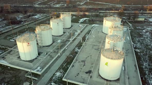 Aerial footage of big fuel reservoires in petrol industrial zone.