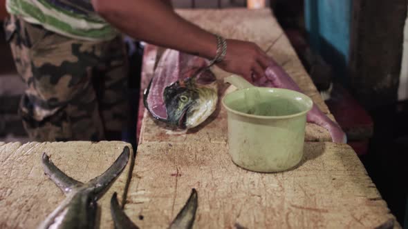 Fish market in Bali cutting fillet