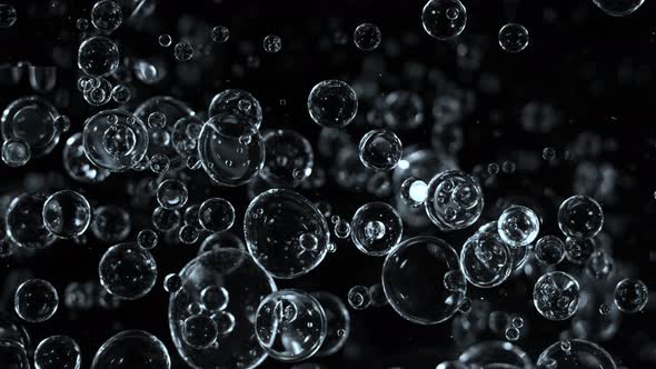 Super Slow Motion Shot of Moving Blue Bubbles Isolated on Black Background at 1000Fps