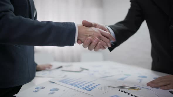 Boss Shaking Hand of New Woman Employee at Office, Successful Recruitment Deal