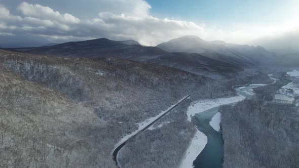 Aerial View of Plateau LagoNaki Mountain Twisted Road in the Winter and Driving Car