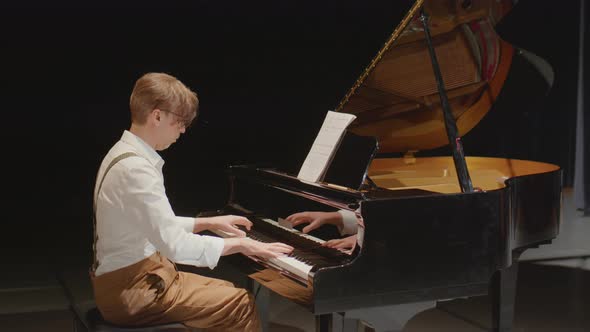 Pianist Giving Performance on Stage