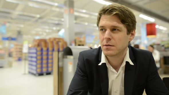 Portrait of Businessman Inside the Supermarket