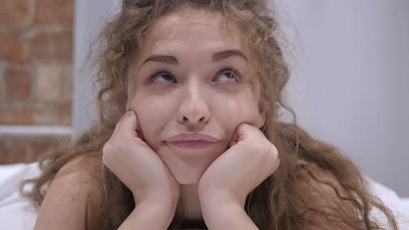 Young Female Getting Bored  in Bed