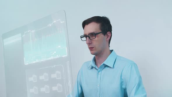 Man Using His High-Tech Computer with Transparent Display