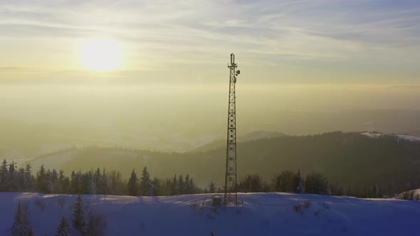 Flying Over Radio Communications Tower Mountain Snow Covered Winter Landscape