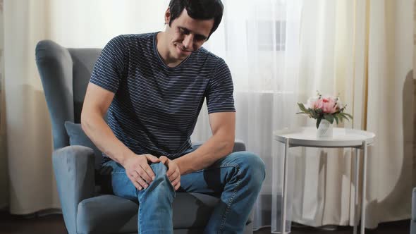 A Man Stroking Painful Knee