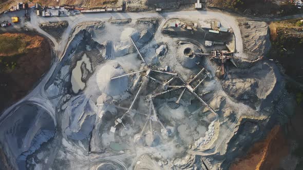 Big Crusher Working with Rubble at a Quarry Moving It on a Line