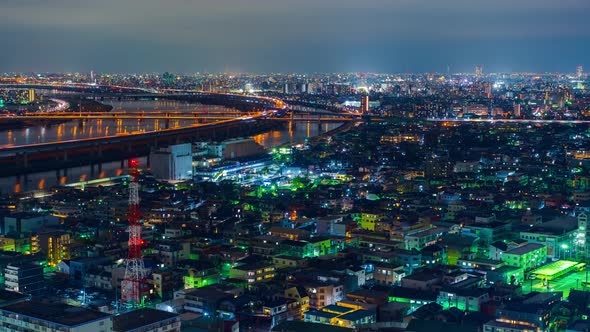 time lapse of cityscape and highway road bridge in Tokyo at night, Japan