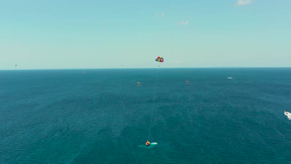 Tourists on a Parachute Over the Sea. Boracay, Philippines