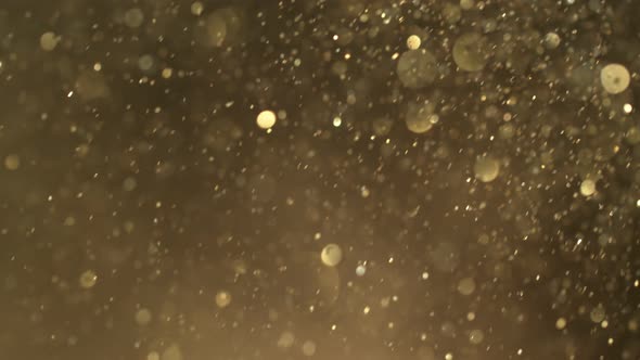 Super Slow Motion Shot of Golden Glitter Background