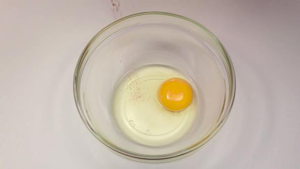 Red Pepper Is Added To Bowl with Egg, Slow Motion