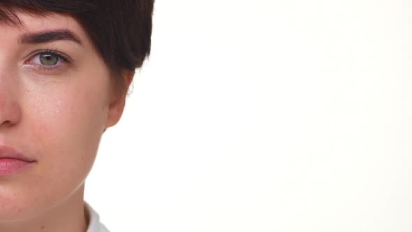 Side Portrait of Nice Shorthaired Girl Opening Eyes Isolated Over White Background Extreme Closeup