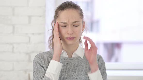 Portrait of Young Latin Woman Having Headache 