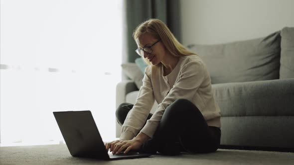 Woman at Home with Laptop