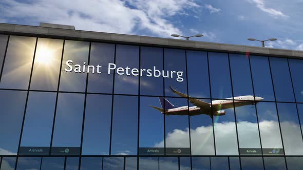 Airplane landing at Saint Petersburg Russia airport mirrored in terminal