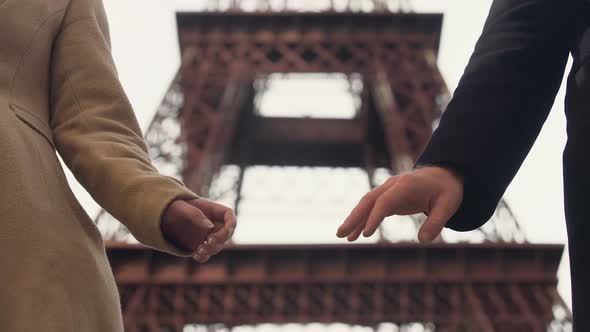 Loving couple hesitantly taking hands deciding to go through life together