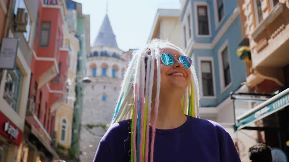 Portrait Woman with Sunglasses and Dreadlocks Walking Street Near Galata Tower