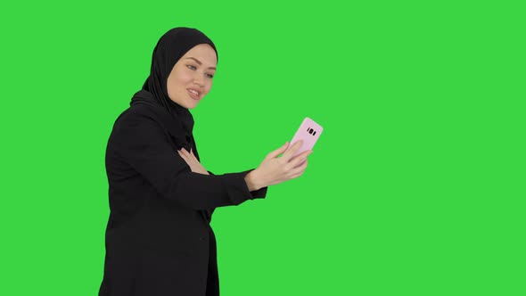 Young Pretty Muslim Woman Hijab Having Video Call Her Phone As She Walks Green Screen Chroma Key