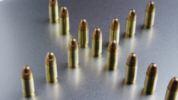 Cinematic rotating shot of bullets on a metallic surface - BULLETS 036