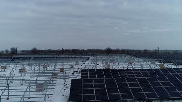 Aerial View of a Construction Site of a Solar Power Station in Winter