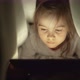 Girl Watching Film on Tablet at Night - VideoHive Item for Sale