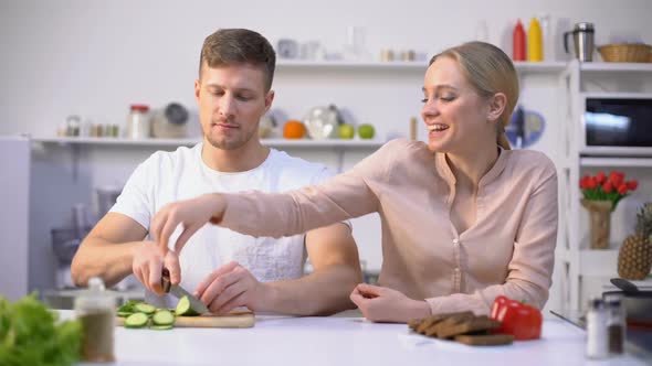 Happy Couple Flirting, Cooking Salad of Fresh Vegetables, Healthy Gmo Free Food