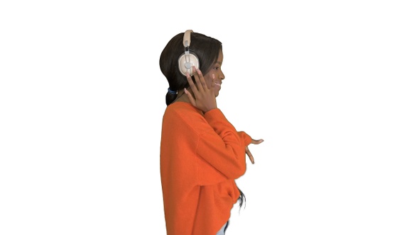 Happy african woman wear wireless headphones listening