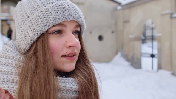 Portrait of Caucasian Pretty Happy Girl with Smile on Face Posing on Winter Citystreet Background