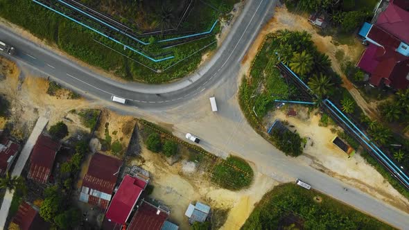 Cinematic Drone Footage of white Mazda Light Vehicle sequences in the middle of the jungle surrounde