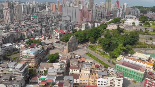 High panning aerial view of Ruins of Saint Paul's and Monte do Forte, Macau