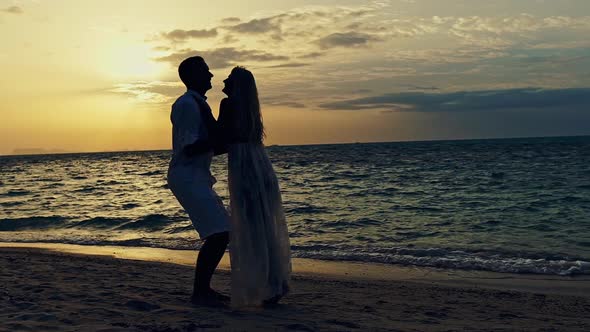 Romantic Couple on Majestic Beach in Sunset