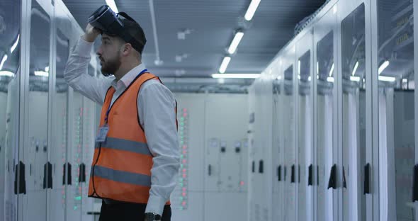 Electrical Worker Wearing a VR Headset