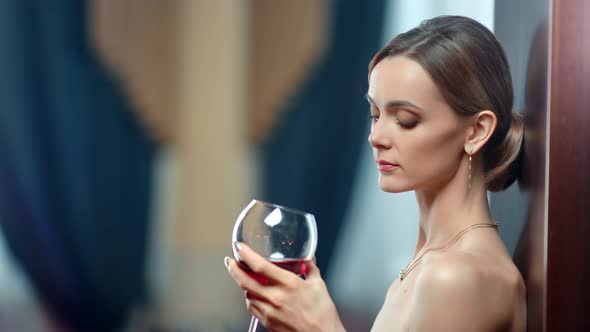 Portrait Sensual Lady Bare Body with Glass of Alcohol Beverage